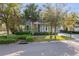 Charming two-story home with a front porch, balcony, well-maintained landscaping, and a driveway at 14123 Barrington Stowers Dr, Lithia, FL 33547