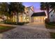 Charming two-story home with a well-maintained yard, two-car garage and beautiful landscaping at 14123 Barrington Stowers Dr, Lithia, FL 33547