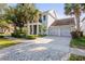Lovely two-story home featuring a front porch, balcony, two-car garage, and paved driveway at 14123 Barrington Stowers Dr, Lithia, FL 33547