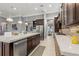 Kitchen featuring a large island with a sink and stainless steel appliances at 14123 Barrington Stowers Dr, Lithia, FL 33547