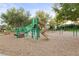 Outdoor playground with swings and slide for endless fun, surrounded by lush greenery and ample space at 14123 Barrington Stowers Dr, Lithia, FL 33547