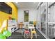 Bright and colorful playroom featuring -sized furniture, a TV, and glass wall to fitness center at 14123 Barrington Stowers Dr, Lithia, FL 33547