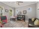 Playful room with a large window, a cozy couch, and ample space for activities at 14123 Barrington Stowers Dr, Lithia, FL 33547