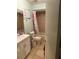 Full bathroom with a white vanity, toilet, and a shower at 1706 E Fern St, Tampa, FL 33610
