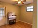 Bedroom with hardwood floors, a ceiling fan, and a window at 1706 E Fern St, Tampa, FL 33610
