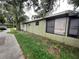 Side view of the house with window view to the interior at 1706 E Fern St, Tampa, FL 33610