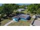 Aerial perspective captures the home's exterior and a fenced yard with trampoline at 2035 Ronald Cir, Seffner, FL 33584