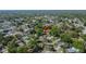 Aerial view of home in a neighborhood surrounded by lush trees and well-manicured lawns at 2035 Ronald Cir, Seffner, FL 33584