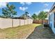 Backyard featuring a privacy fence and a grassy lawn, offering a serene and private outdoor space at 2035 Ronald Cir, Seffner, FL 33584