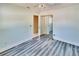Bedroom with wood-look flooring, closet, ceiling fan, and a neutral color palette at 2035 Ronald Cir, Seffner, FL 33584
