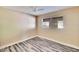 Bedroom with wood-look flooring, ceiling fan, and a neutral color palette at 2035 Ronald Cir, Seffner, FL 33584