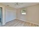 Bright bedroom features a ceiling fan, a window for natural light, and closet with bi-fold doors at 2035 Ronald Cir, Seffner, FL 33584