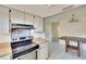 Bright eat-in kitchen features tiled floors, modern oven, and table at 2035 Ronald Cir, Seffner, FL 33584