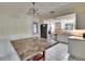 Functional kitchen with white cabinetry, stainless steel appliances, and tile flooring at 2035 Ronald Cir, Seffner, FL 33584