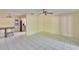 Bright and airy living room featuring neutral walls, tile flooring, and a ceiling fan at 2035 Ronald Cir, Seffner, FL 33584