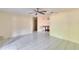 Inviting living room with tile flooring, neutral tones, and a view into the adjacent dining area at 2035 Ronald Cir, Seffner, FL 33584