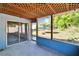 Screened porch leads to a large backyard with a trampoline at 2035 Ronald Cir, Seffner, FL 33584