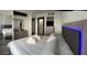 Spacious main bedroom with a bed, mirror, and stylish decor at 20861 Haulover Cv # 5, Lutz, FL 33558