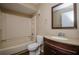 Functional bathroom featuring a tub-shower, toilet, and vanity with sink at 2440 Enterprise Rd # 2, Clearwater, FL 33763