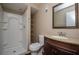 Well-lit bathroom featuring a walk-in shower, modern toilet, and vanity with a sink at 2440 Enterprise Rd # 2, Clearwater, FL 33763