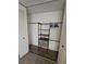 A closet with shelves and hanging space offers practical storage solutions at 2440 Enterprise Rd # 2, Clearwater, FL 33763