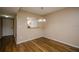 Inviting dining area featuring stylish wood floors and a modern chandelier for elegant meals at 2440 Enterprise Rd # 2, Clearwater, FL 33763