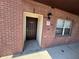 The building entrance shows a new door and window and well-maintained brick facade at 2440 Enterprise Rd # 2, Clearwater, FL 33763