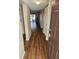 Inviting entryway with laminate flooring, coat closet, and smooth transition to living area at 2440 Enterprise Rd # 2, Clearwater, FL 33763