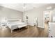 Spacious bedroom with wood floors, large windows, and a glimpse of the en suite bathroom at 2570 12Th N Pl, St Petersburg, FL 33713