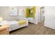 Cozy bedroom featuring modern decor, wood floors, and a comfortable bed at 2570 12Th N Pl, St Petersburg, FL 33713