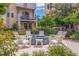 Outdoor fire pit with Adirondack chairs in a landscaped community space at 2570 12Th N Pl, St Petersburg, FL 33713