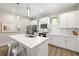 Modern kitchen with white cabinets, quartz countertops, and stainless steel appliances, perfect for cooking at 2570 12Th N Pl, St Petersburg, FL 33713