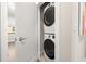 Convenient laundry closet with stacked washer and dryer, maximizing space and efficiency at 2570 12Th N Pl, St Petersburg, FL 33713