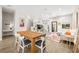 Open-concept living space with a dining area, a comfortable sofa, and staircase views at 2570 12Th N Pl, St Petersburg, FL 33713