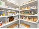 Organized pantry with wire shelving and wooden storage baskets, offering ample storage space at 2570 12Th N Pl, St Petersburg, FL 33713