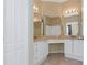 Bright bathroom with double sink vanity, granite countertop, and tile floors at 2730 Via Tivoli # 321B, Clearwater, FL 33764