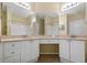 Bright bathroom with double sink vanity, granite countertop, and tile floors at 2730 Via Tivoli # 321B, Clearwater, FL 33764