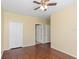 Bedroom with closet, wood floors, and access to bathroom at 2730 Via Tivoli # 321B, Clearwater, FL 33764