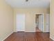 Bedroom with closet, wood floors, and access to bathroom at 2730 Via Tivoli # 321B, Clearwater, FL 33764