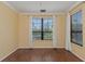 Bright bedroom with wood flooring, crown molding, and large windows at 2730 Via Tivoli # 321B, Clearwater, FL 33764