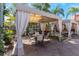 Comfortable cabana seating offers a shaded space to relax, complete with table and chairs at 2730 Via Tivoli # 321B, Clearwater, FL 33764