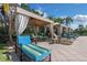 Relaxing poolside cabanas offer a shaded retreat with comfortable seating, perfect for lounging and socializing at 2730 Via Tivoli # 321B, Clearwater, FL 33764