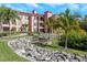 Beautifully landscaped grounds with lush greenery, picnic tables and seating benches at 2730 Via Tivoli # 321B, Clearwater, FL 33764