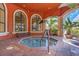 Relaxing indoor hot tub, surrounded by plants and windows with seating at 2730 Via Tivoli # 321B, Clearwater, FL 33764