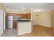 Bright kitchen with stainless steel appliances, granite countertops, and a large open space for dining at 2730 Via Tivoli # 321B, Clearwater, FL 33764
