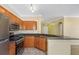 Modern kitchen with stainless steel appliances, granite counters, and an open design for easy access at 2730 Via Tivoli # 321B, Clearwater, FL 33764