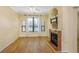 Bright living room with a fireplace, hardwood floors, large windows and lots of natural light at 2730 Via Tivoli # 321B, Clearwater, FL 33764