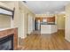 Spacious living room showcasing an open floor plan, fireplace, and access to the modern kitchen at 2730 Via Tivoli # 321B, Clearwater, FL 33764
