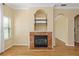 Cozy living room featuring a fireplace, hardwood floors, and neutral walls, creating a warm and inviting space at 2730 Via Tivoli # 321B, Clearwater, FL 33764