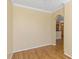 Open-concept living room with hardwood flooring and archway to the kitchen area at 2730 Via Tivoli # 321B, Clearwater, FL 33764